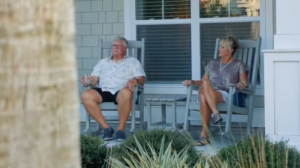 couple in rocking chairs on porch