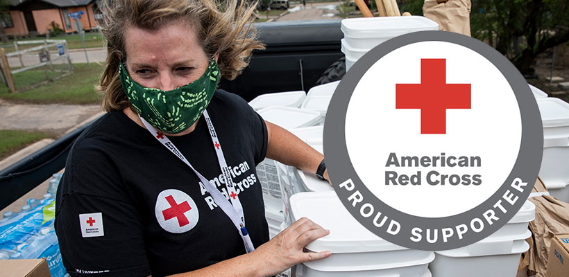 Female volunteer collecting donations for the Red Cross.