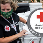 Red cross female worker collecting donations.