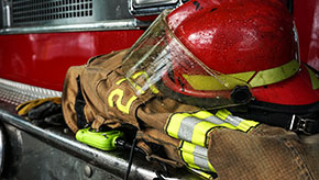 Firefighter's gear sitting on a firetruck.