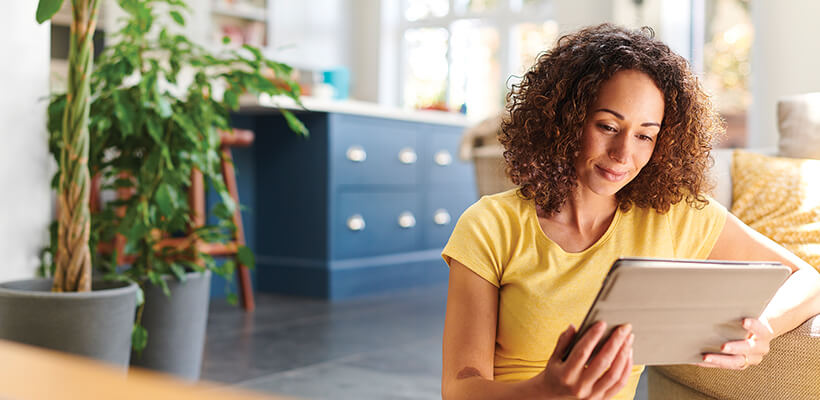 A young woman uses GoalWise on her laptop.