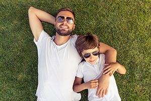 Dad and son resting outdoors
