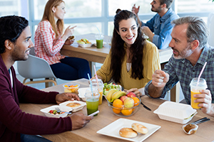 Associates having lunch together in an office setting.