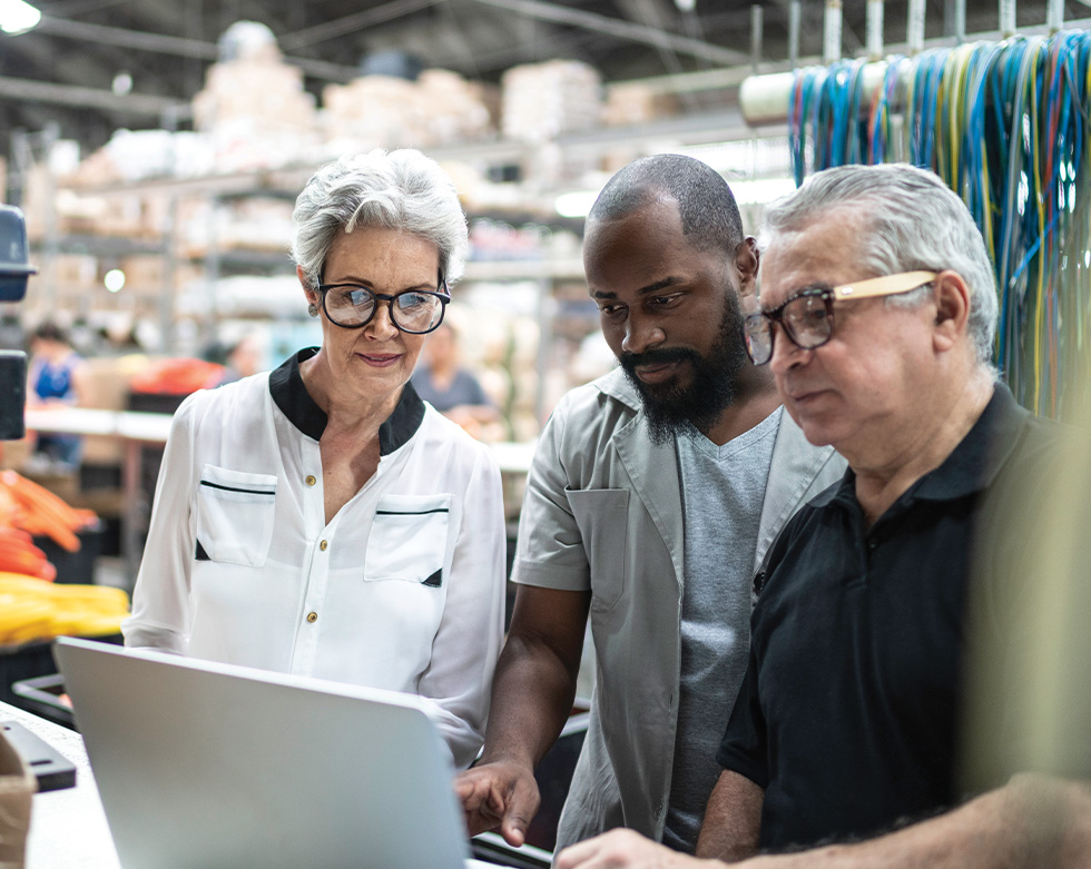 Coworkers working together in factory