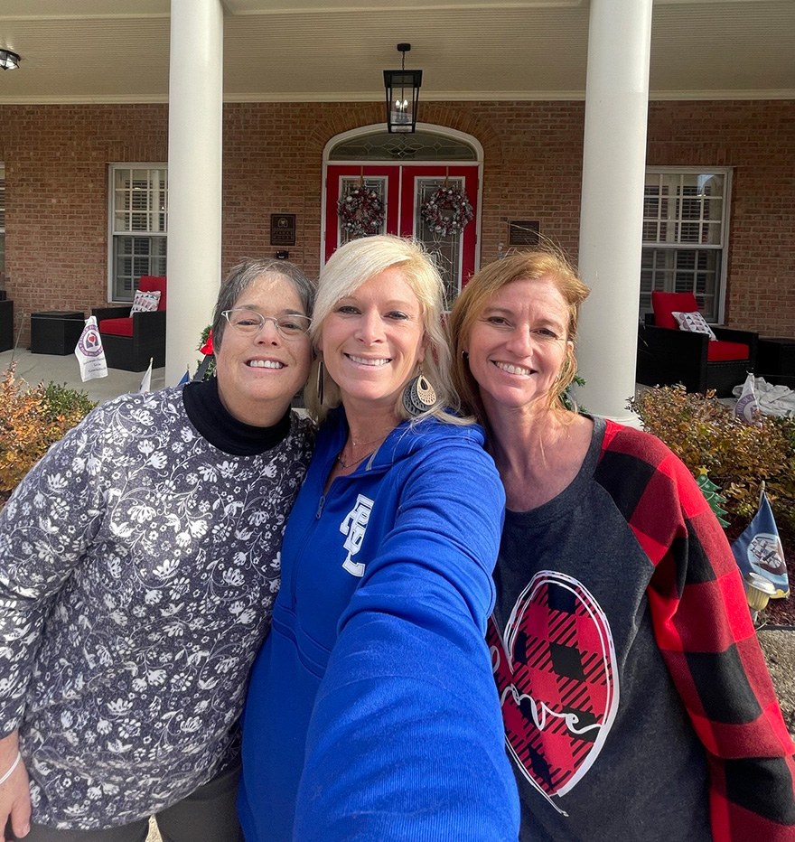 Arts-Culture Ameritas employees pose for selfie at a community event