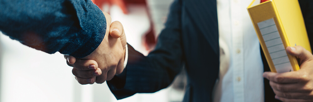 Two business associates shaking hands.