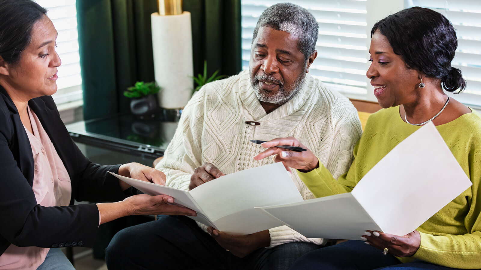A couple in their 60s works with their financial professional to establish their estate plan.