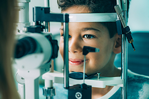 Young male getting an eye exam.