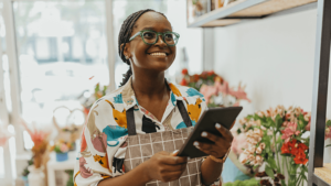 A small business owner runs her flower shop.