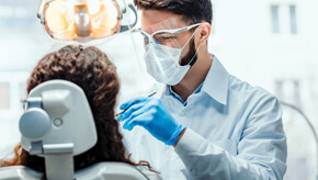 Dentist giving a patient and exam.