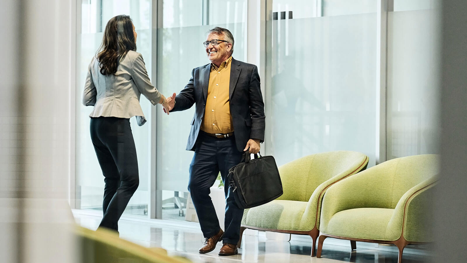 A financial professional meets with a plan sponsor client in her office to review their retirement plan offerings. A financial professional meets with a plan sponsor client in her office to review their retirement plan offerings.