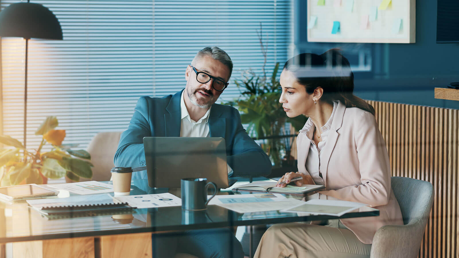 A business owner meets with her financial professional to go over updated SECURE Act 2.0 rules for her retirement plan. A business owner meets with her financial professional to go over updated SECURE Act 2.0 rules for her retirement plan.
