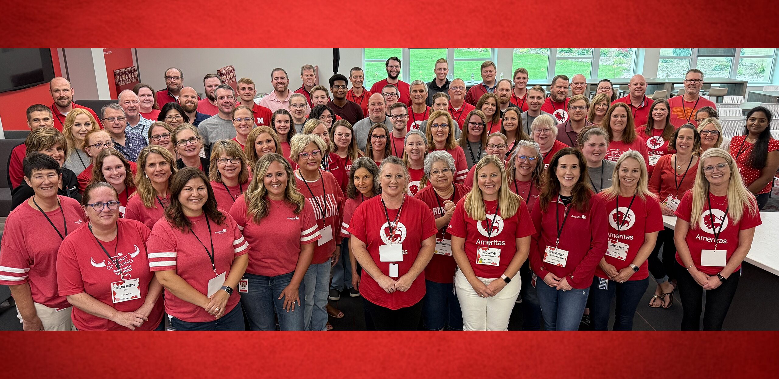 A group of Ameritas associates gathering for a photo in the Home Office.
