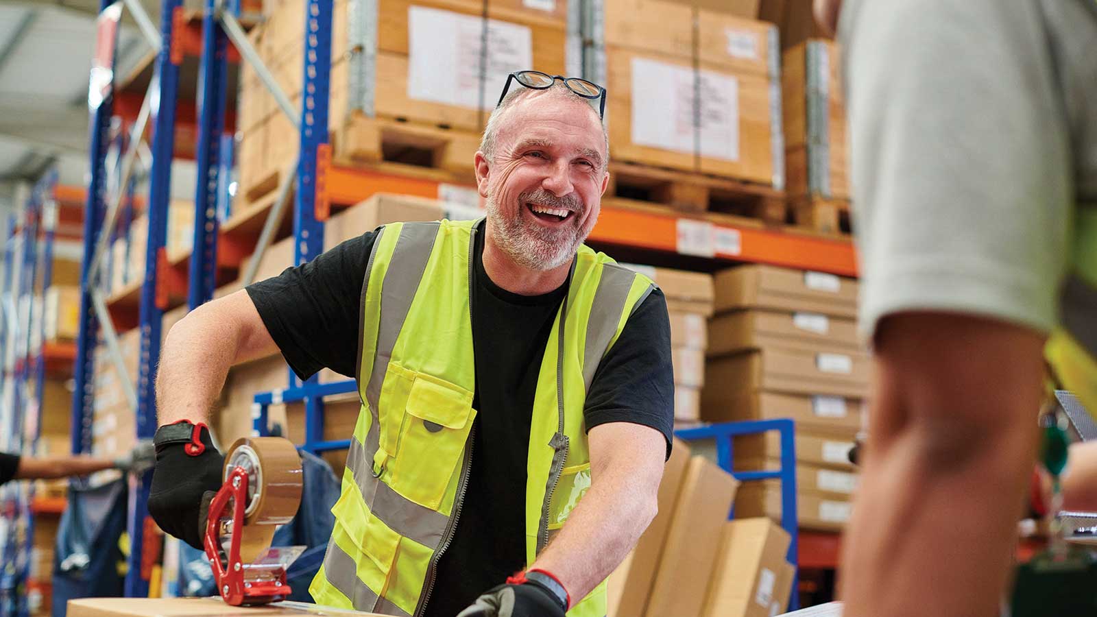 Man working at construction job smiling.