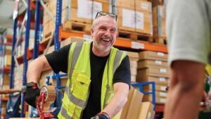 Man working at construction job smiling.
