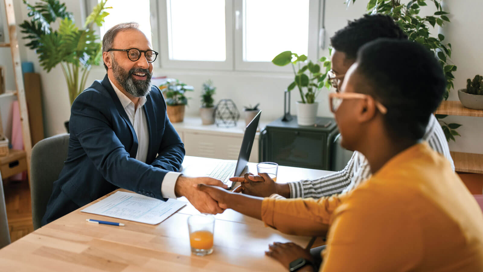 A financial professional and a client discussing life insurance.