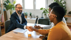 A financial professional and a client discussing life insurance.