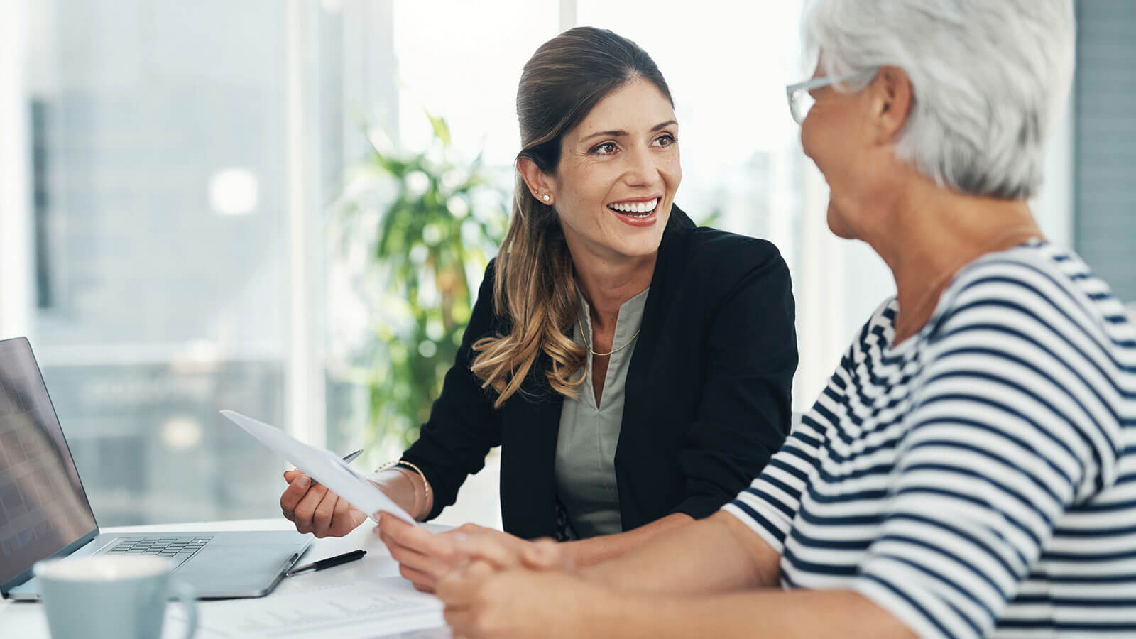 A financial professional meets with a client in her 60s to discuss using annuities for income in retirement.