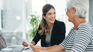 A financial professional meets with a client in her 60s to discuss using annuities for income in retirement.