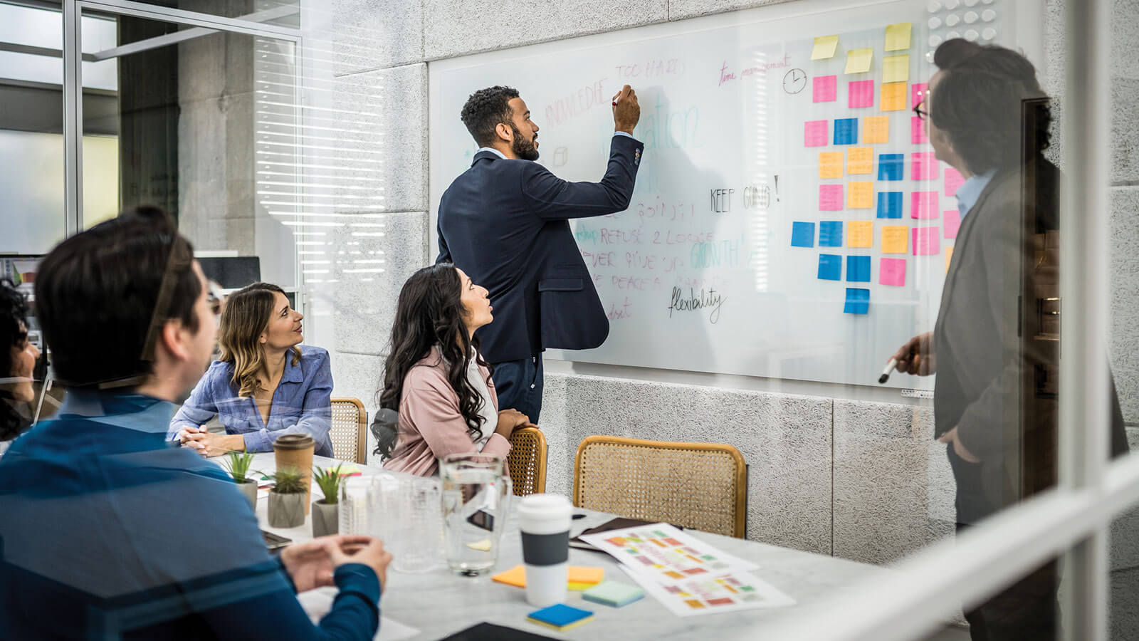 Business leaders collaborate on employee benefits and financial wellness strategies to support workforce engagement and organizational growth.