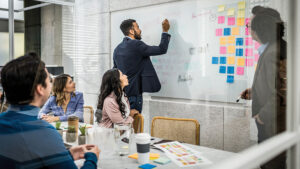 Business leaders collaborate on employee benefits and financial wellness strategies to support workforce engagement and organizational growth.